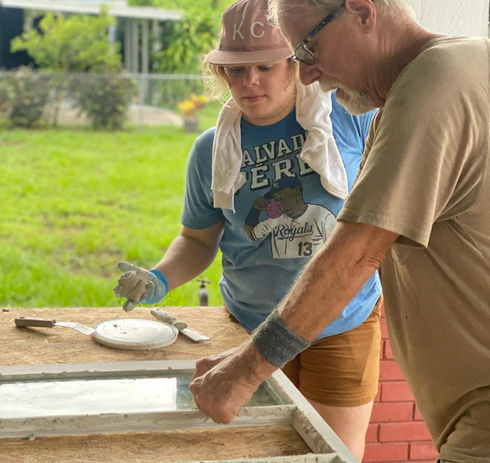 Two craftsmen working together at a bench