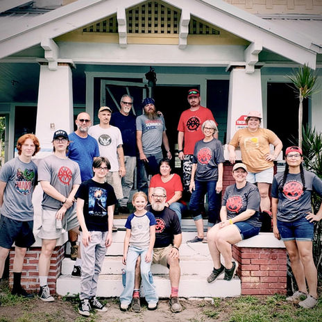 WindowFest participants gathered on the porch of a historic house